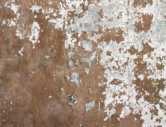 混凝土墙覆盖破碎的油漆和泥土图片