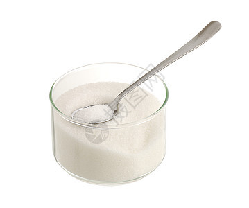 白糖加茶匙玻璃碗中的白糖图片