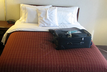 旅馆房间行李床头柜包装酒店衣服汽车睡眠游客枕头商业手提箱图片