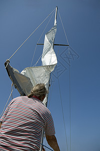航行水手假期海洋日落索具风帆运动天空游艇钻机背景图片