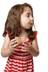 小女孩鲜美甜甜甜圈图片