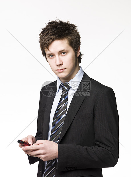 拥有手机的商务人士衬衫短信呼唤男人移动电话商业业务员电话通讯领带图片