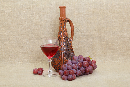 格鲁吉亚的泥土瓶 玻璃和葡萄的成分图片