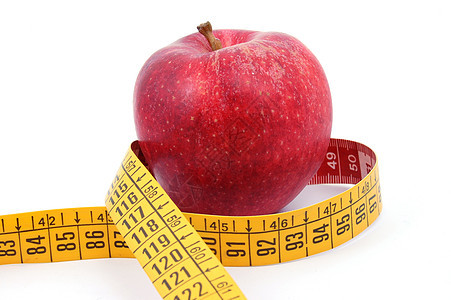 苹果和白色的测量胶带红色减肥控制磁带腰部饮食食物损失疾病医疗图片