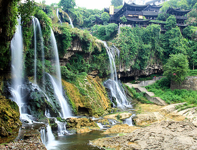 水落到一个中国村少数民族村庄地质房子乡村地质学岩石瀑布电影溪流图片