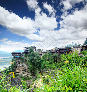 a 中国少数民族村景色乡村风景天空吸引力村庄溪流电影少数民族住宅房子图片