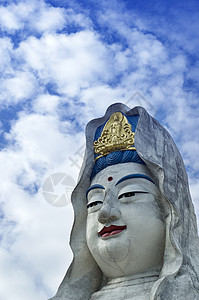 Guanyin 雕像宗教女性历史文化警卫菩萨男性雕塑传统天空背景图片