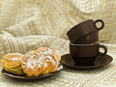 面包和杯子包子餐具蛋糕服务沙漠茶点早餐陶瓷小吃食物图片