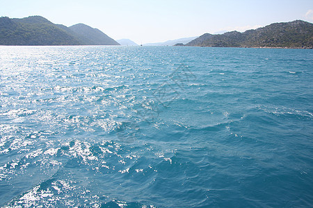 地中海居民航行旅行波浪游艇树木蓝色石质快乐岩石火鸡图片