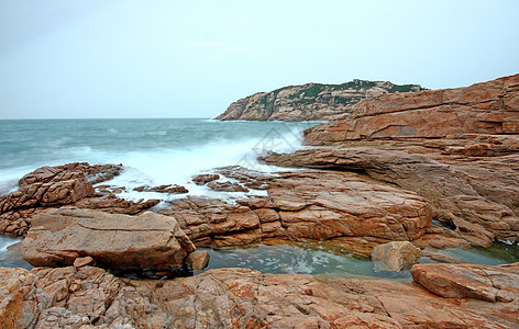 香港石O海洋海浪天际蓝天海岸线石头场景渔夫景观男人图片