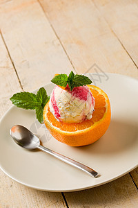 橙色冰淇淋奶油状创意美食草药桌子香气乳制品水果甜点叶子图片