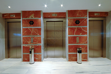现代旅馆的电梯门商业门厅金属建筑酒店建筑学按钮大理石地面入口图片