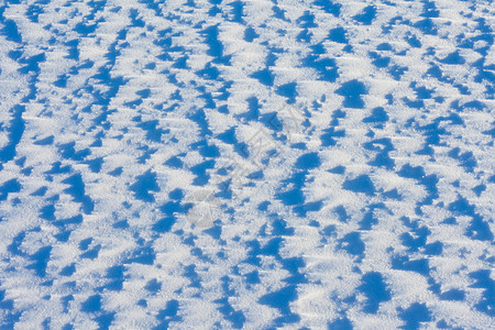 雪地背景纹理模式清扫荒野粉状阴影结晶粉末白色雪景阳光太阳图片