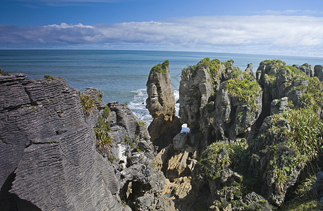 Punakaiki 煎饼摇滚项目海岸地质学地平线悬崖海岸线支撑石头蓝色岩石图片