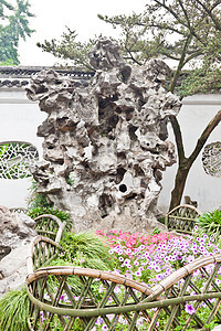 中国苏州有名的齐济林花园吸引力狮子编队岩石房子花园住宅森林建筑物池塘图片