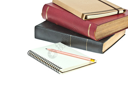 纸笔 奶油彩色纸笔记本和作为背景的书籍图片