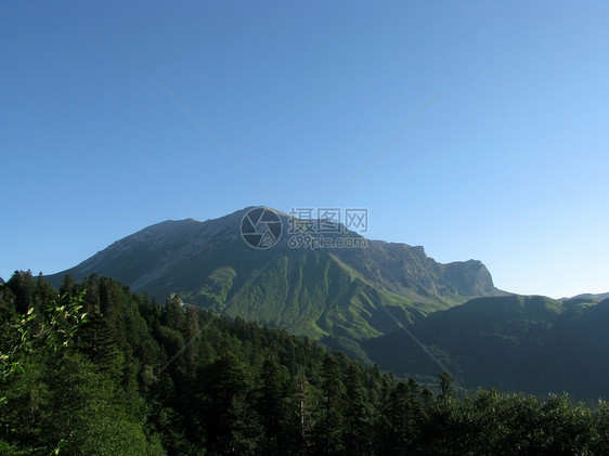 山山脉风景岩石天空斜坡生物高地旅行全景植物高原图片