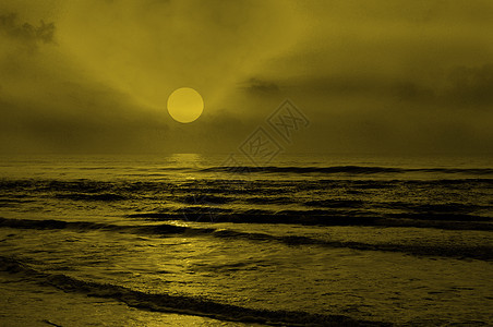 日出日落反射阳光海浪橙子天际地平线海滩天蓝色海岸线图片