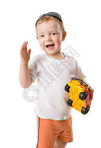 男孩拿着玩具头发婴儿男生好奇心喜悦儿童快乐白色儿子幸福图片