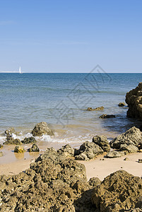 乌亚海滩和克利夫斯海浪海滩海岸运动棕色悬崖蓝色岩石海洋图片