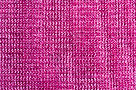 粉红色织布背景的纹理图片
