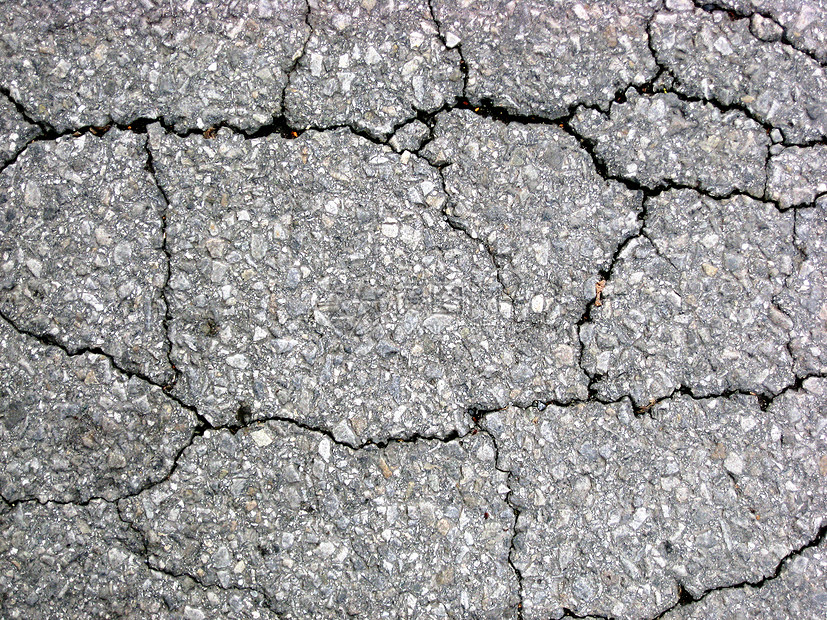 沥青背景的裂缝损害地面黑色路面墙纸石头宏观街道人行道灰色图片