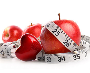 白色的红苹果 心脏和测量胶带图片