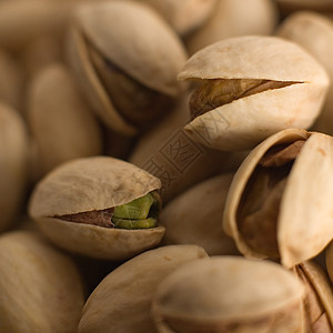 Pistachios 螺旋藻小吃开心果宏观种子盐渍食物水果核心坚果图片