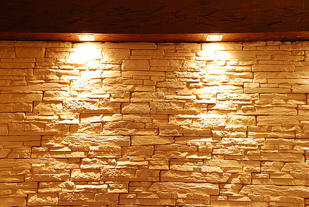 带亮灯的不形石墙砖墙灰色积木建筑照明建筑学水平酒吧木头岩石背景图片
