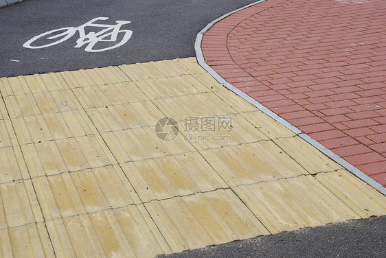 自行车车道骑术路线运动沥青街道路标公园车辆白色地面图片