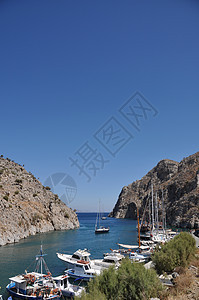 卡利姆诺斯岛石头天空花朵土地海景场景航行海岸支撑海浪图片