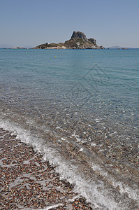 Kefalos海滩岩石海岸风景鹅卵石场景天空支撑假期旅行石头图片