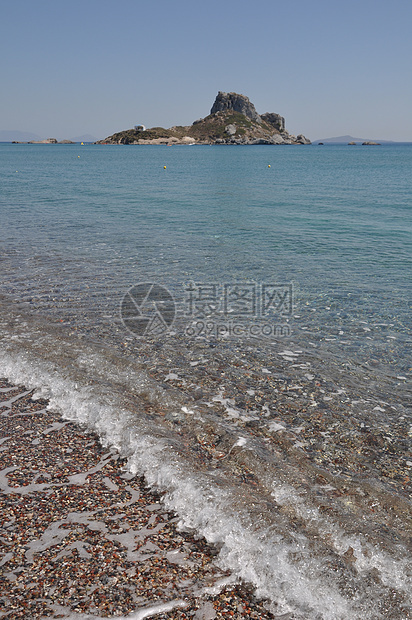 Kefalos海滩岩石海岸风景鹅卵石场景天空支撑假期旅行石头图片