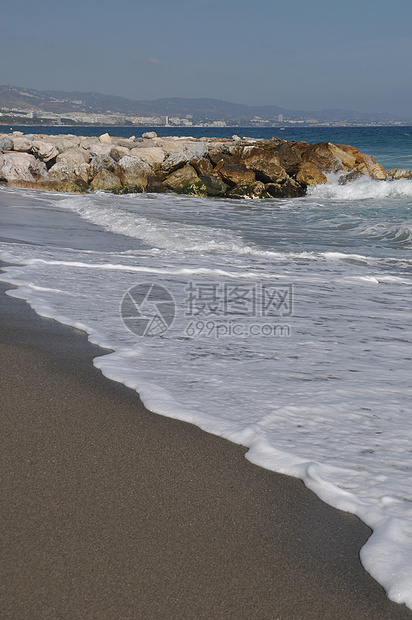 巴努斯港海滩和石码头海洋岩石支撑海岸旅游海岸线场景天空海景蓝色图片