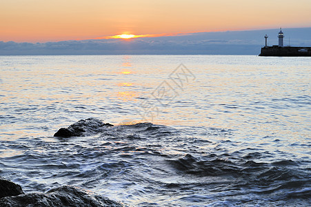 灯泡冲浪海滩岩石灯塔日落地平线灯光太阳安全旅行图片