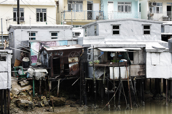 Tai O 香港一个小渔村木头蓝色村庄住宅天空钓鱼旅行场景棚户区房子图片