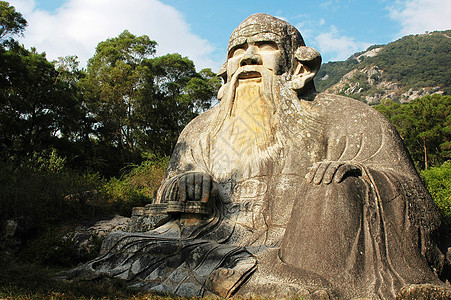 老挝巨雕像旅游雕塑宗教岩石老子胡须蓝色祖先天空石头背景图片