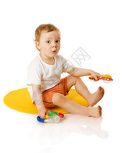 男孩玩游戏玩具乐趣金发男生童年地毯儿童白色喜悦快乐图片