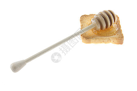 木制蜂蜜干燥器和面包上的蜂蜜早餐食物植物营养梳子金子蜂窝液体木头勺子图片