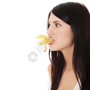年轻妇女吃炸薯条垃圾乐趣筹码薯条芯片青少年重量快乐饮食小吃图片