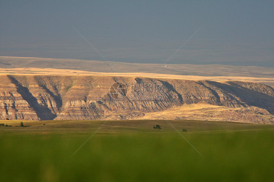 萨斯喀彻温大湿地谷岩层农村场景乡村阴影土地旅行暴风云丘陵植被图片