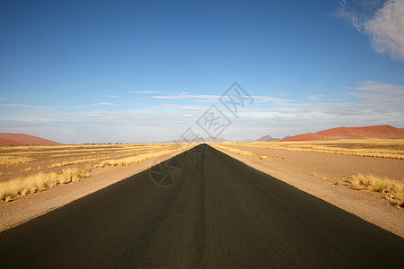 纳米比亚公路旅行土地风景小路岩石环境速度天空地平线日出图片