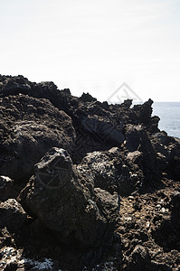 火山岩支撑悬崖边缘海岸线火山蓝色海岸海景地质地质学图片