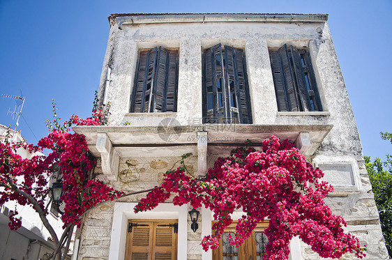 地中海之家的面孔建筑旅行蓝色入口石头房子村庄天空植物建筑学图片