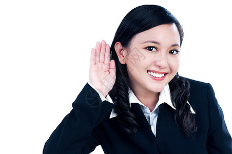 快乐的年轻女商务人士 把手放在耳朵上图片