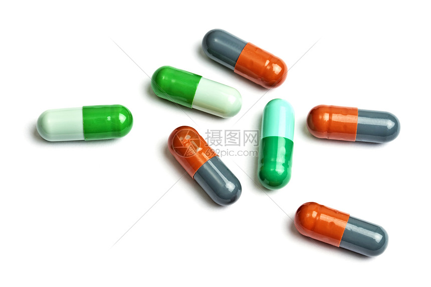 在白色上隔离的 几个色彩多彩的胶囊药品概念绿色框架药店治疗制药化学宏观橙子高清图片下载-正版图片320613393-摄图网