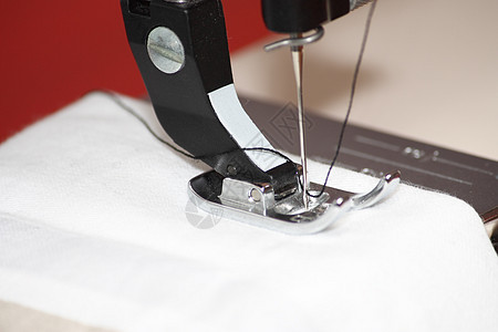 缝织机宏观跑步材料工人接缝针脚女士戏服裁缝衣服图片