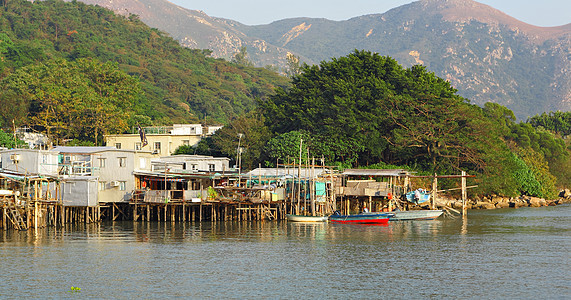 香港Tai O渔业村房子蓝色木头旅行村庄场景钓鱼风化窝棚住宅图片