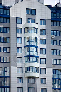 现代办公楼条纹美丽商业脚手架财产蓝色不动产摩天大楼阳光城市图片