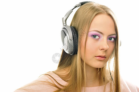 使用耳机的年轻女孩流行音乐记录享受白色收音机活动女士舞蹈闲暇音乐播放器图片